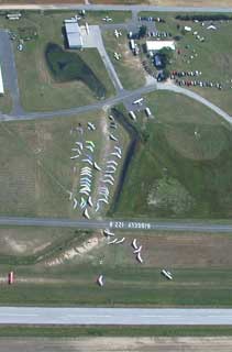 Solo pilots getting their hang gliders ready to fly.
